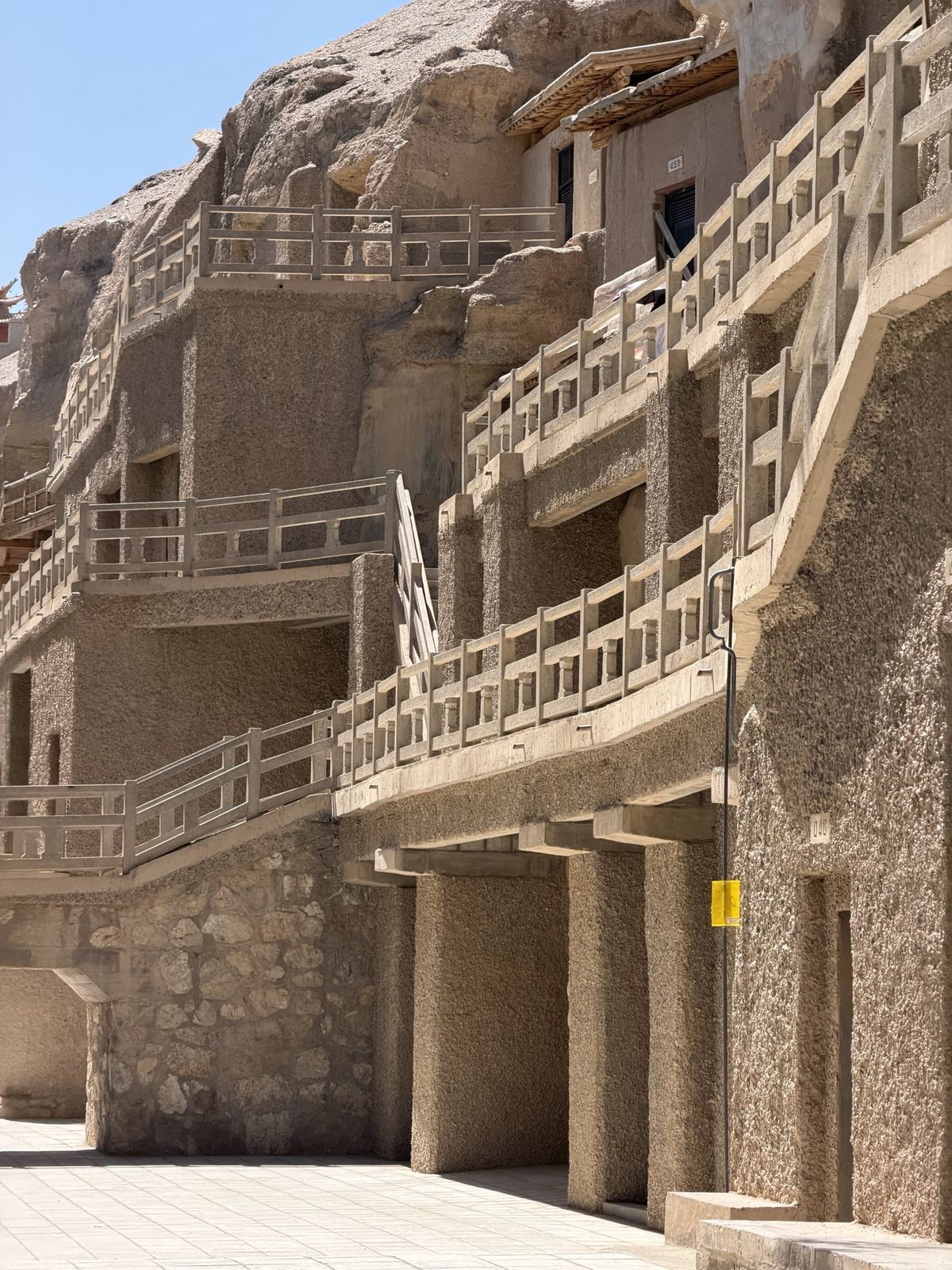Walkways and cave doors along the cliff of the Mogao Caves