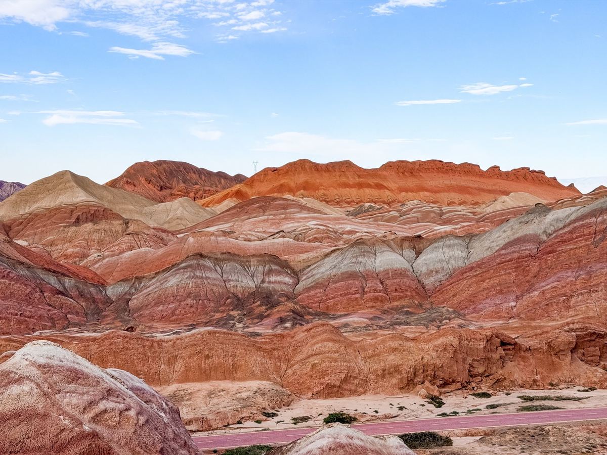 Panorama of red, orange and white striped hills in the Zhangye Danxia Rainbow Mountains