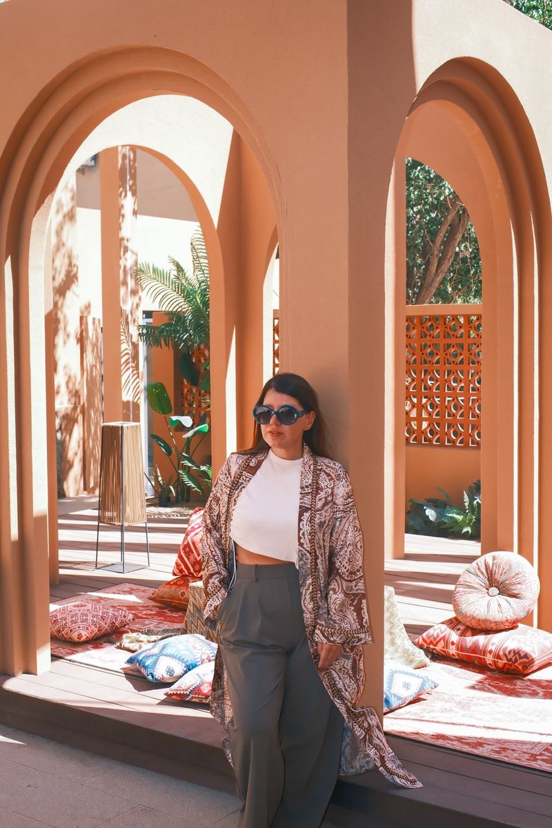 Terracotta arches and cushions in the courtyard of the Boman Oasis Resort