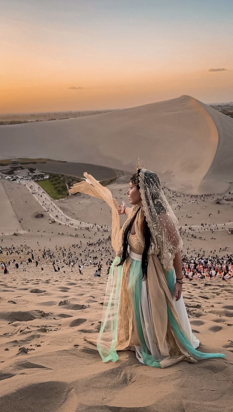 Linda in hanfu with silk ribbons on the dunes above Crescent Lake, Dunhuang