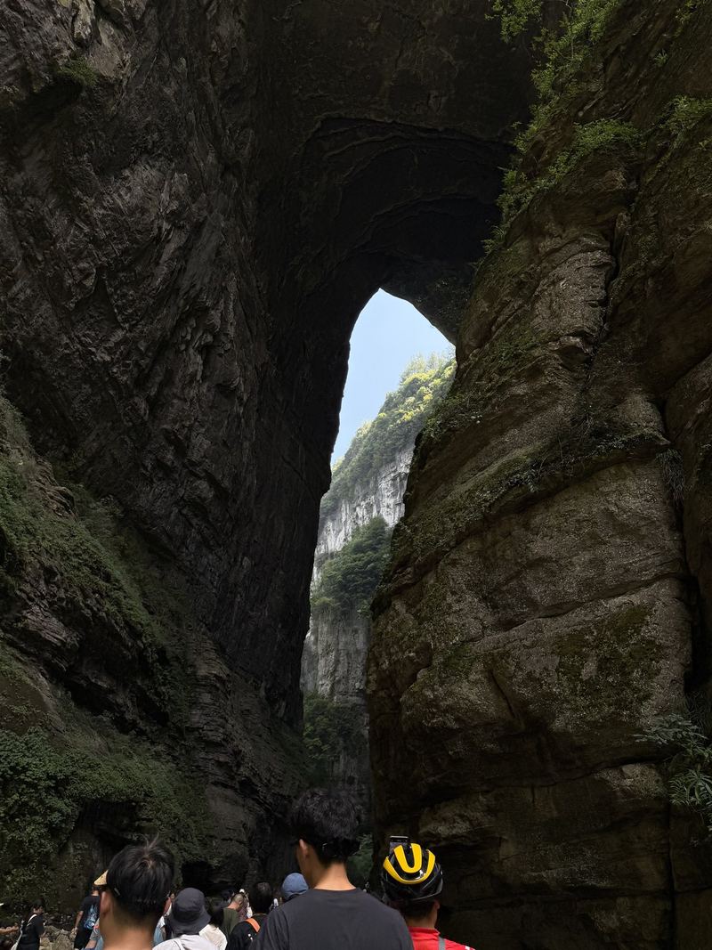 Looking up through the arch of a natural bridge in Wulong