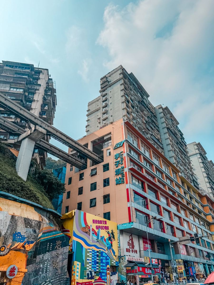 The Line 2 monorail track entering a residential building at Liziba station, Chongqing