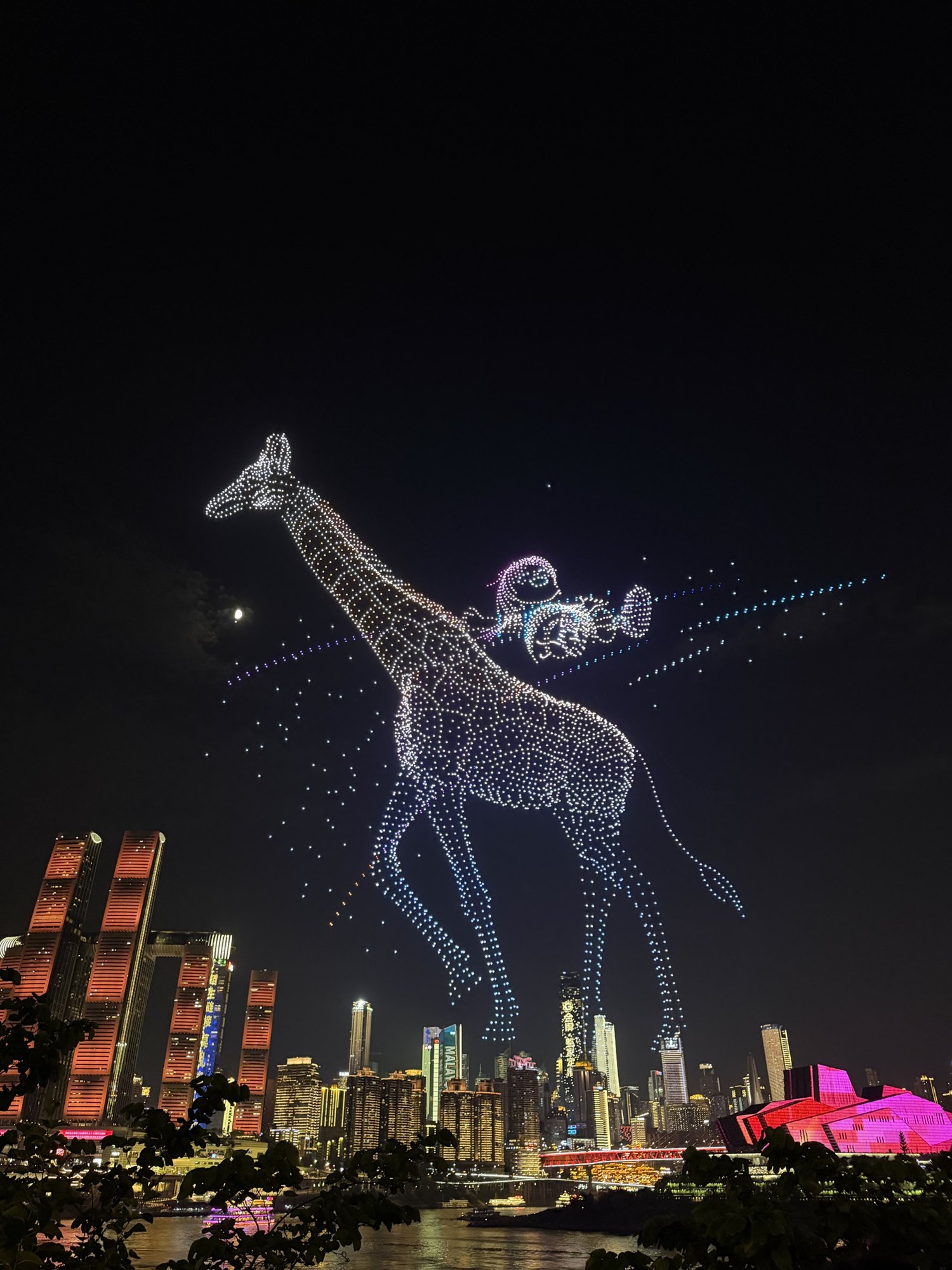 A giraffe drawn by thousands of drones above Raffles City, Chongqing drone show