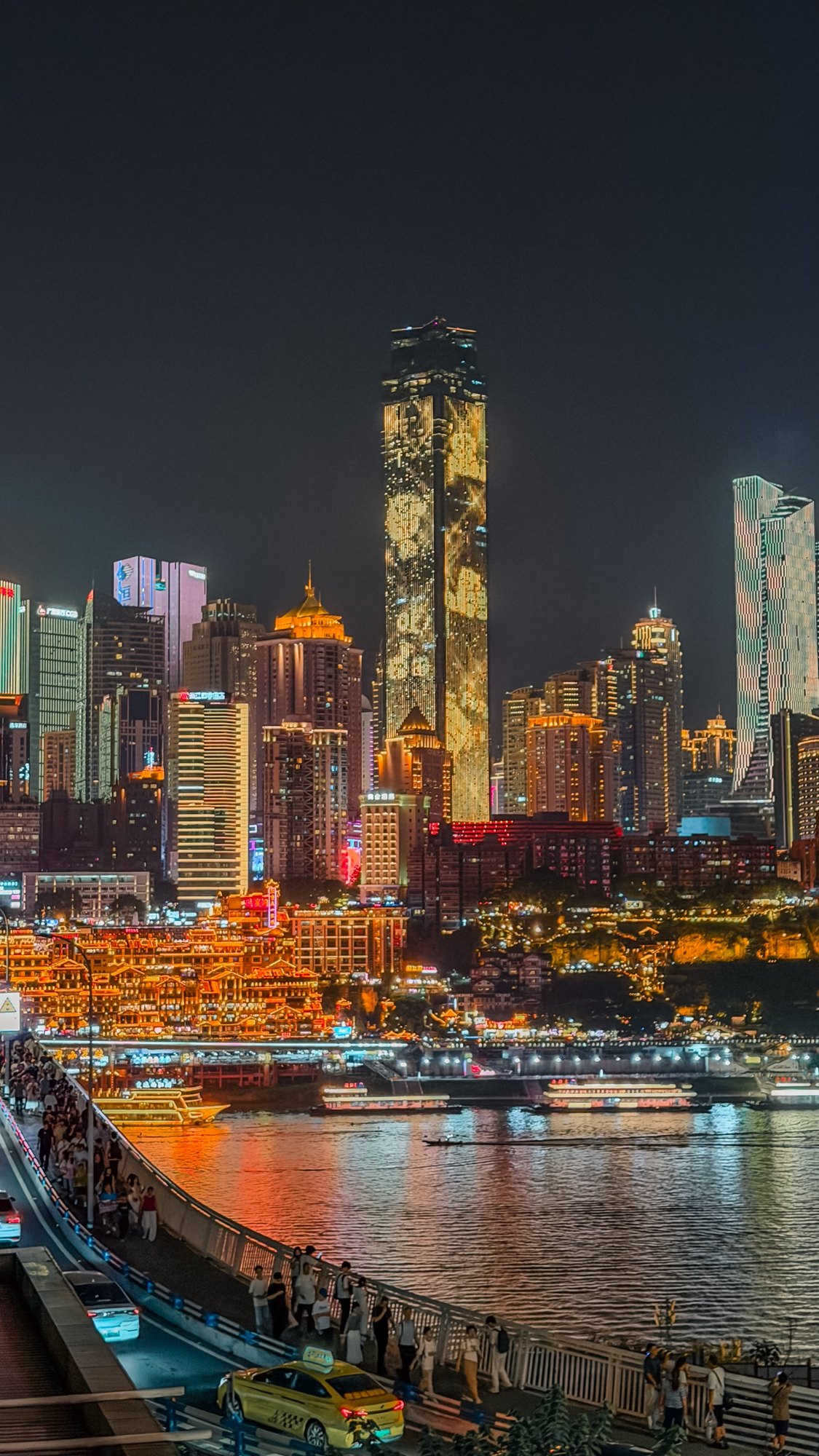 Hongyadong and the Chongqing skyline reflected in the Jialing River at night
