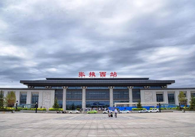 Zhangye West railway station under a cloudy sky